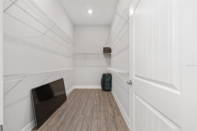 spacious closet with wood finished floors