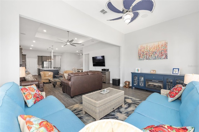 living room featuring visible vents, recessed lighting, ceiling fan, and dark wood-style flooring