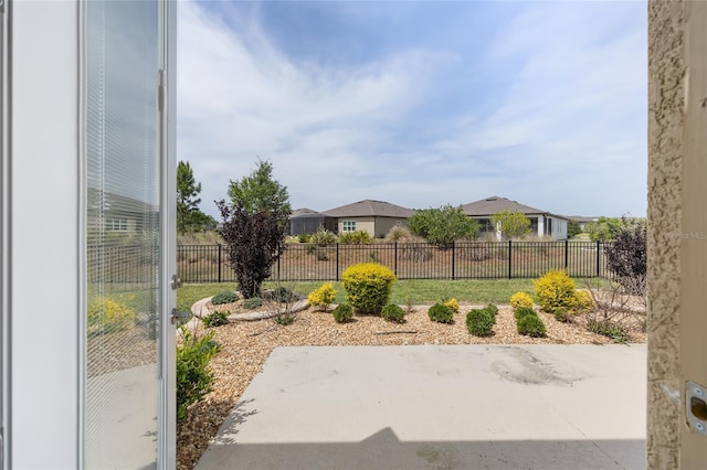 view of yard with fence and a patio