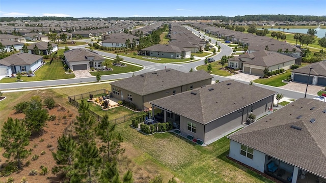aerial view with a residential view and a water view