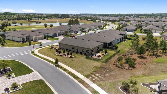 birds eye view of property featuring a residential view and a water view
