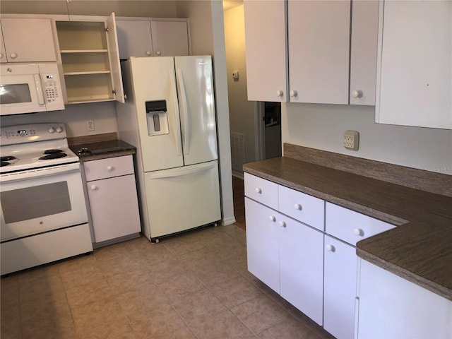 9896 SW 61st Ct, Ocala, FL 34476 - kitchen featuring dark countertops, white appliances, and white cabinetry