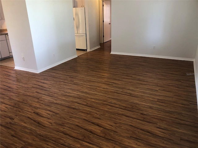 9896 SW 61st Ct, Ocala, FL 34476 - spare room with baseboards and dark wood-style flooring