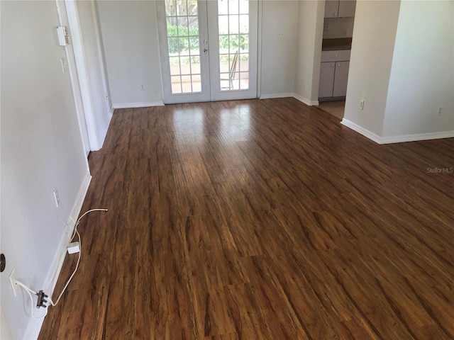 9896 SW 61st Ct, Ocala, FL 34476 - empty room with baseboards, dark wood finished floors, and french doors