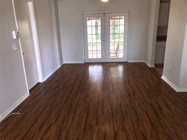 9896 SW 61st Ct, Ocala, FL 34476 - unfurnished dining area with baseboards, french doors, and dark wood-style flooring