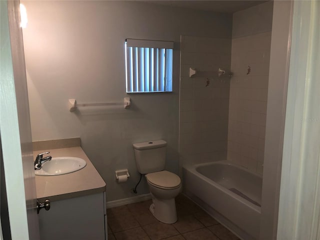 9896 SW 61st Ct, Ocala, FL 34476 - bathroom with shower / tub combination, tile patterned flooring, vanity, toilet, and baseboards