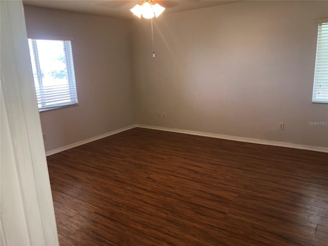 9896 SW 61st Ct, Ocala, FL 34476 - empty room featuring baseboards, dark wood finished floors, and ceiling fan