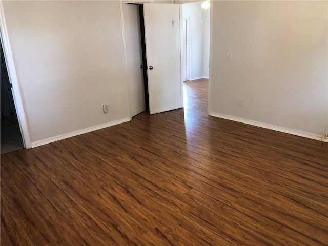 9896 SW 61st Ct, Ocala, FL 34476 - empty room with baseboards and dark wood finished floors
