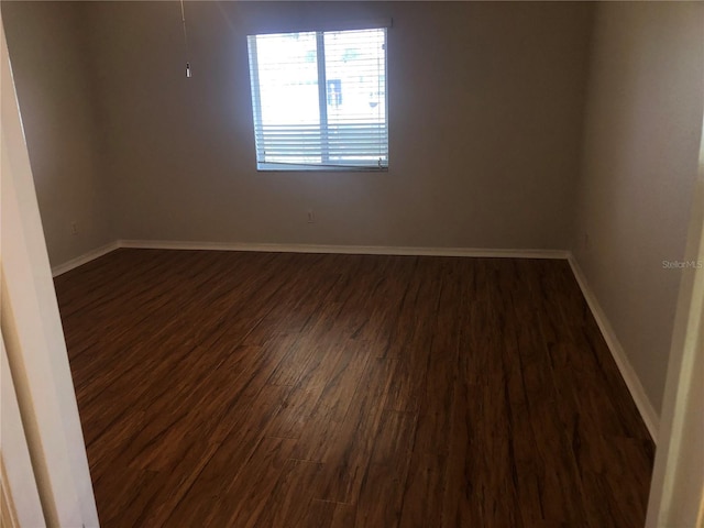 9896 SW 61st Ct, Ocala, FL 34476 - unfurnished room featuring dark wood-style flooring and baseboards
