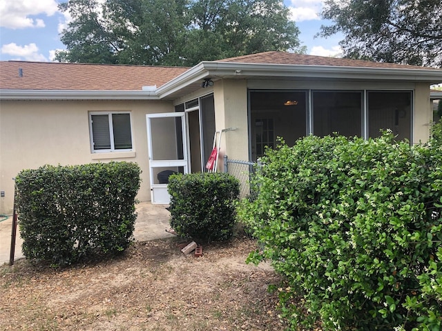 9896 SW 61st Ct, Ocala, FL 34476 - entrance to property featuring a shingled roof and stucco siding