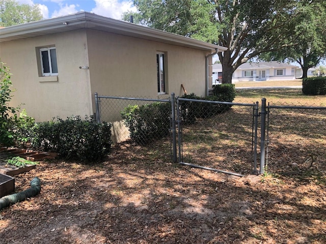 9896 SW 61st Ct, Ocala, FL 34476 - view of side of property featuring fence and a gate