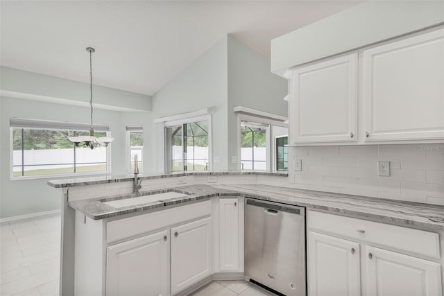 kitchen with dishwasher, vaulted ceiling, a sink, and a wealth of natural light