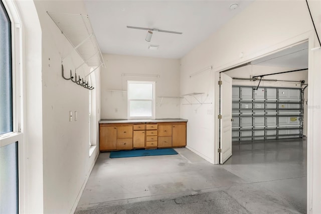 interior space featuring baseboards