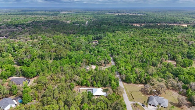 bird's eye view featuring a wooded view