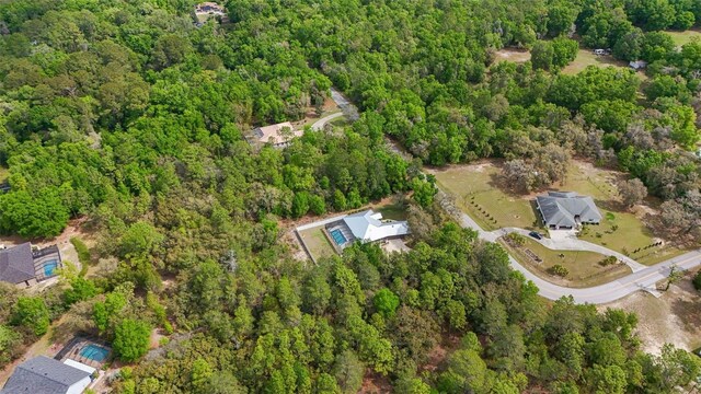drone / aerial view with a view of trees