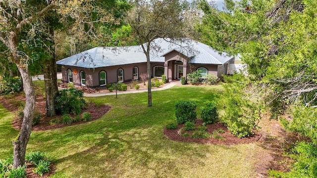 ranch-style house with a front lawn and stucco siding