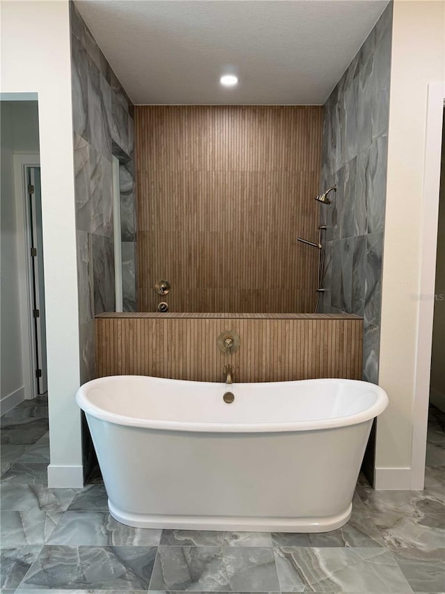 18890 SW 60th St, Dunnellon, FL 34432 - bathroom with a soaking tub, recessed lighting, marble finish floor, and baseboards