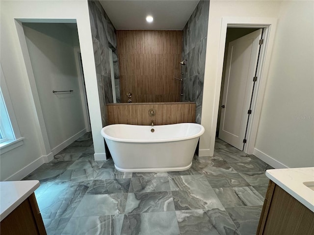 18890 SW 60th St, Dunnellon, FL 34432 - full bath featuring a freestanding tub, vanity, marble finish floor, and baseboards