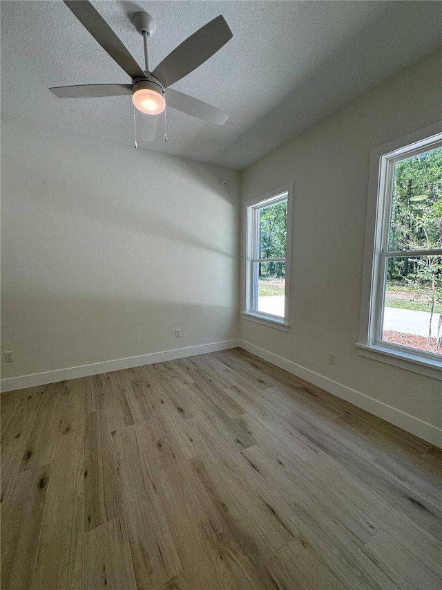 18890 SW 60th St, Dunnellon, FL 34432 - spare room featuring light wood finished floors, baseboards, and a healthy amount of sunlight