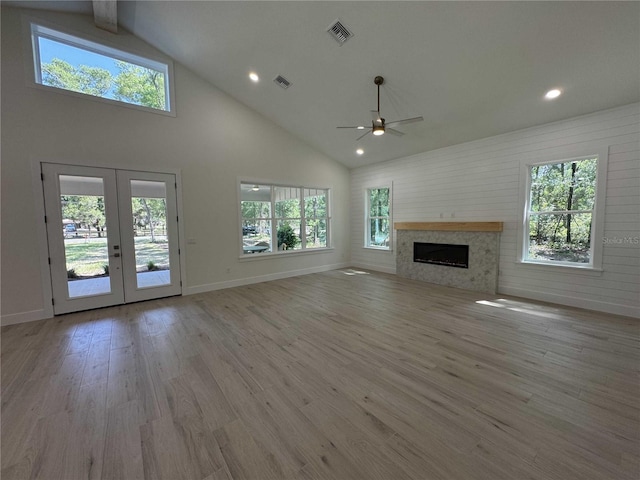 18890 SW 60th St, Dunnellon, FL 34432 - unfurnished living room with visible vents, ceiling fan, high vaulted ceiling, and french doors