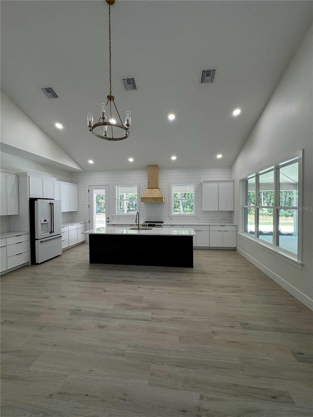 18890 SW 60th St, Dunnellon, FL 34432 - kitchen featuring visible vents, recessed lighting, high end refrigerator, and premium range hood