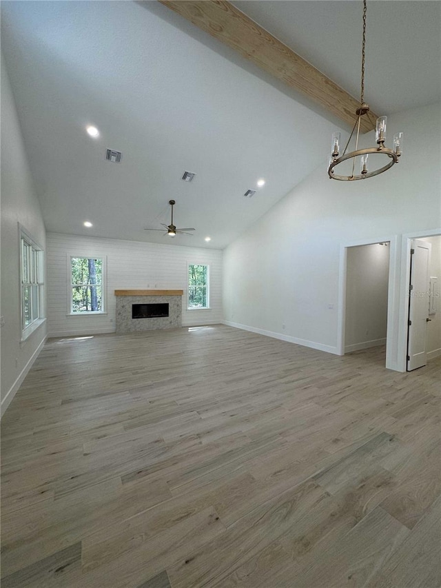 18890 SW 60th St, Dunnellon, FL 34432 - unfurnished living room featuring a wealth of natural light, recessed lighting, baseboards, and ceiling fan with notable chandelier