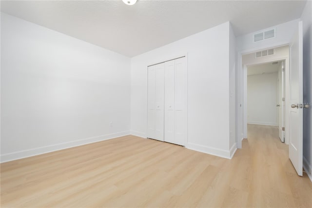 1074 SE 52nd St, Keystone Heights, FL 32656 - unfurnished bedroom featuring visible vents, light wood-style flooring, and baseboards