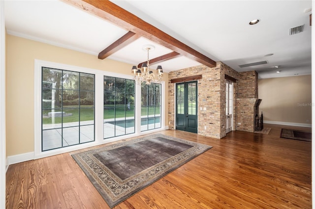 950 SW 43rd Pl, Ocala, FL 34471 - unfurnished dining area featuring a healthy amount of sunlight, baseboards, a chandelier, and visible vents