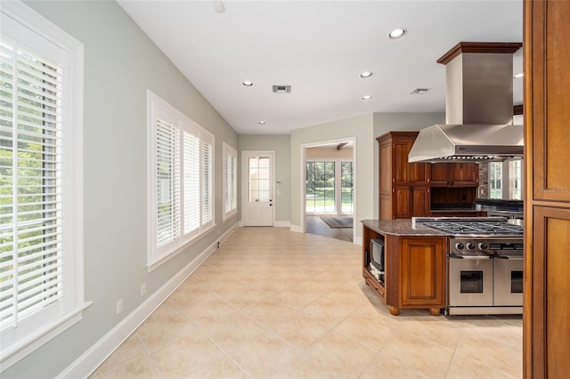 950 SW 43rd Pl, Ocala, FL 34471 - kitchen featuring visible vents, light tile patterned flooring, recessed lighting, range with two ovens, and island exhaust hood