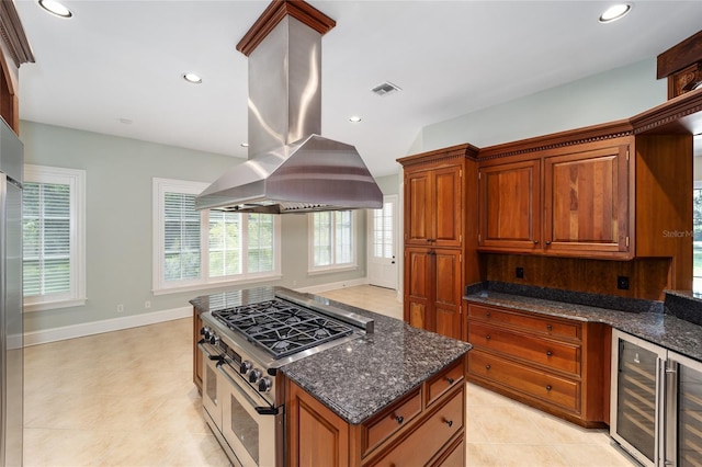 950 SW 43rd Pl, Ocala, FL 34471 - kitchen with visible vents, baseboards, beverage cooler, high quality appliances, and island exhaust hood