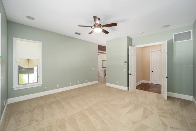950 SW 43rd Pl, Ocala, FL 34471 - unfurnished bedroom featuring a ceiling fan, baseboards, visible vents, and carpet