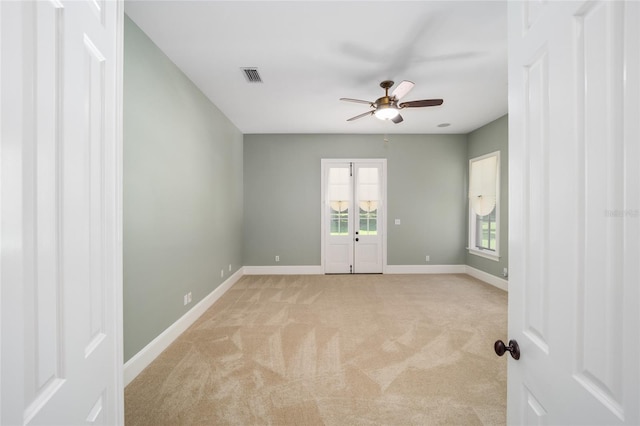 950 SW 43rd Pl, Ocala, FL 34471 - unfurnished room featuring light colored carpet, baseboards, ceiling fan, and visible vents