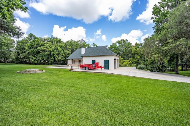 950 SW 43rd Pl, Ocala, FL 34471 - exterior space with a yard, an attached garage, driveway, and stucco siding