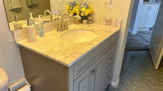 bathroom with vanity and tile patterned floors