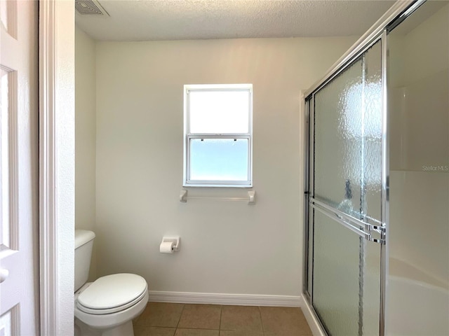 15782 SW 16th Avenue Rd, Ocala, FL 34473 - full bathroom with a shower stall, visible vents, tile patterned floors, and toilet