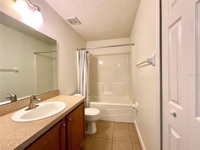 15782 SW 16th Avenue Rd, Ocala, FL 34473 - full bathroom with a textured ceiling, toilet, visible vents, tile patterned flooring, and vanity