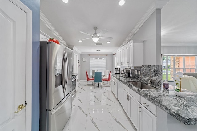 kitchen with ornamental molding, recessed lighting, a sink, and stainless steel fridge with ice dispenser