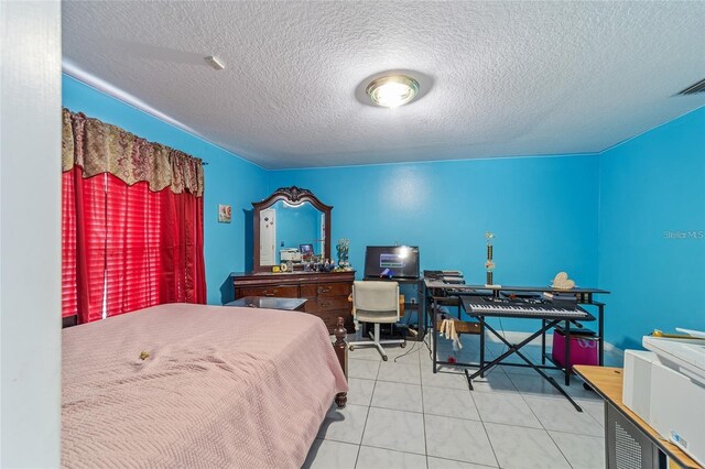 bedroom featuring visible vents and a textured ceiling