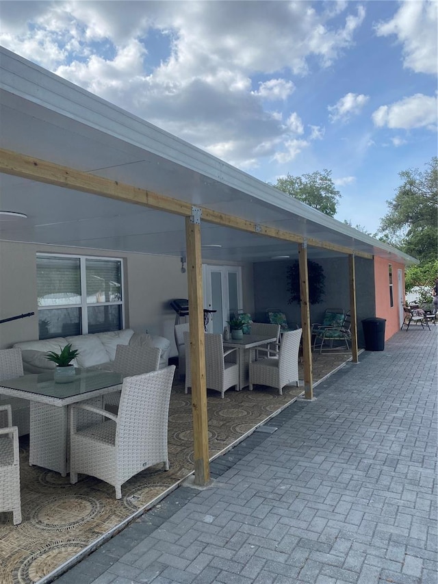 view of patio / terrace with outdoor dining area and french doors