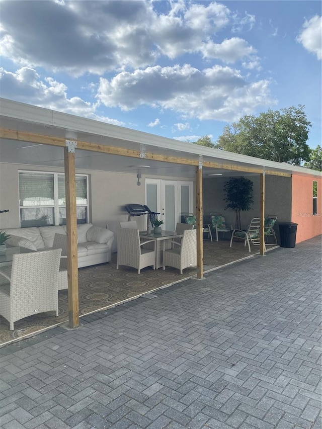 view of patio / terrace featuring outdoor lounge area and french doors