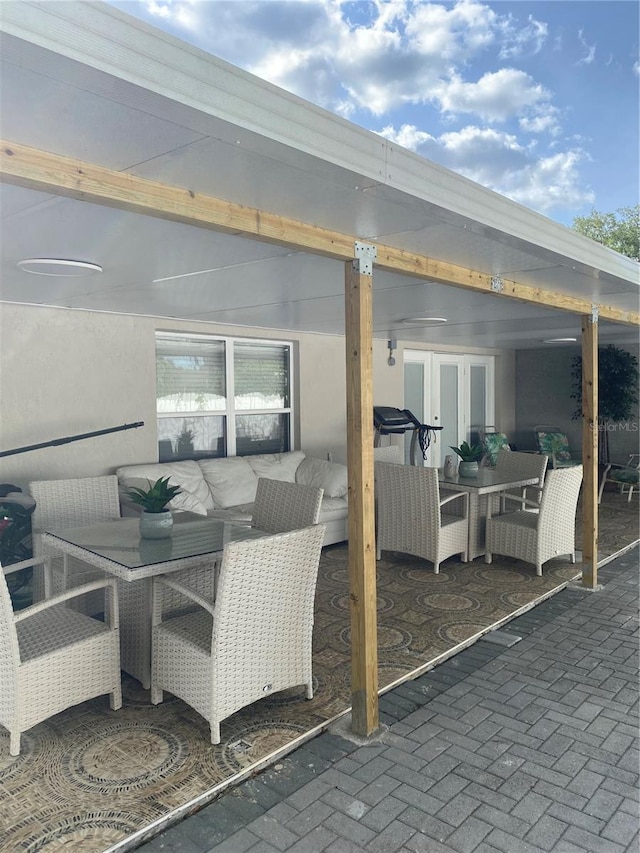 view of patio featuring french doors and outdoor dining area