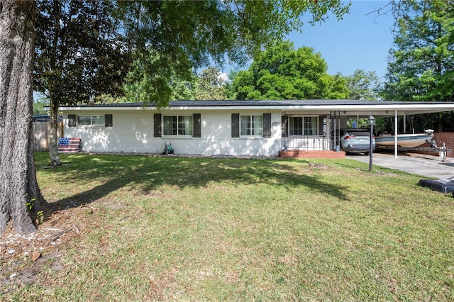 219 NW 7th St, Williston, FL 32696 - ranch-style house with a front lawn and an attached carport