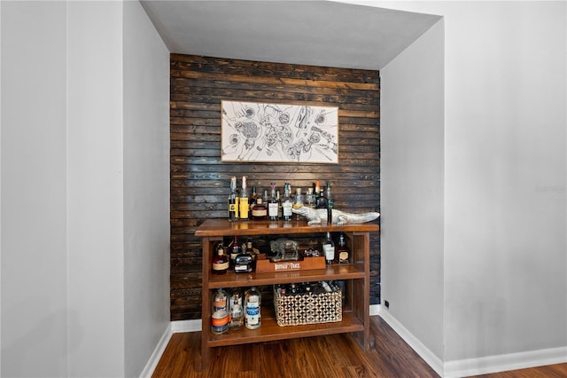 219 NW 7th St, Williston, FL 32696 - bar with a bar, baseboards, and wood finished floors