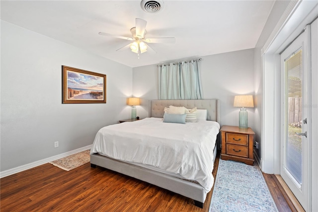 219 NW 7th St, Williston, FL 32696 - bedroom with baseboards, multiple windows, wood finished floors, and visible vents