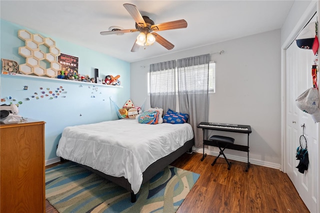 219 NW 7th St, Williston, FL 32696 - bedroom featuring a closet, baseboards, ceiling fan, and wood finished floors