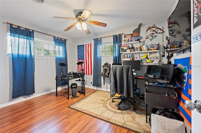 219 NW 7th St, Williston, FL 32696 - office space featuring baseboards, a ceiling fan, and wood finished floors