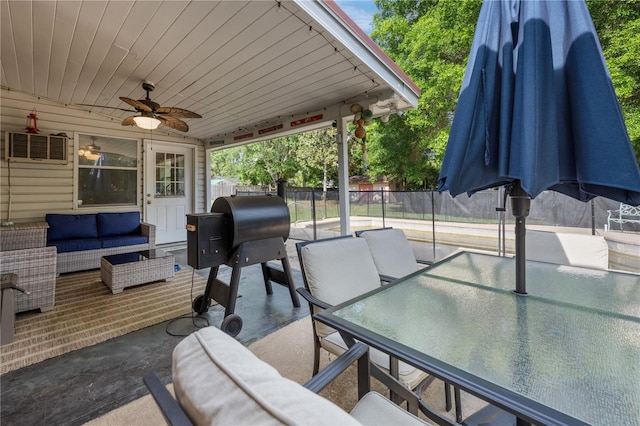 219 NW 7th St, Williston, FL 32696 - view of patio / terrace with ceiling fan, outdoor lounge area, fence, a wall unit AC, and outdoor dining space