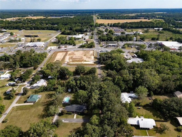 219 NW 7th St, Williston, FL 32696 - drone / aerial view featuring a wooded view