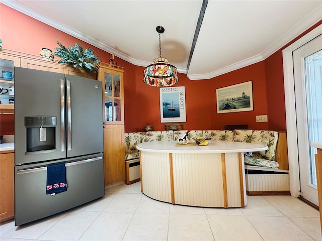 kitchen with stainless steel fridge, light countertops, crown molding, and glass insert cabinets