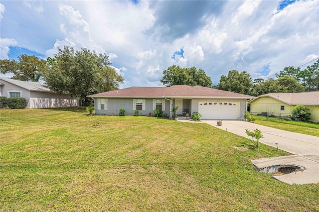 single story home with a front yard, concrete driveway, and a garage